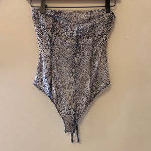 A body suit from free people! mesh and slightly see through. Strapless!